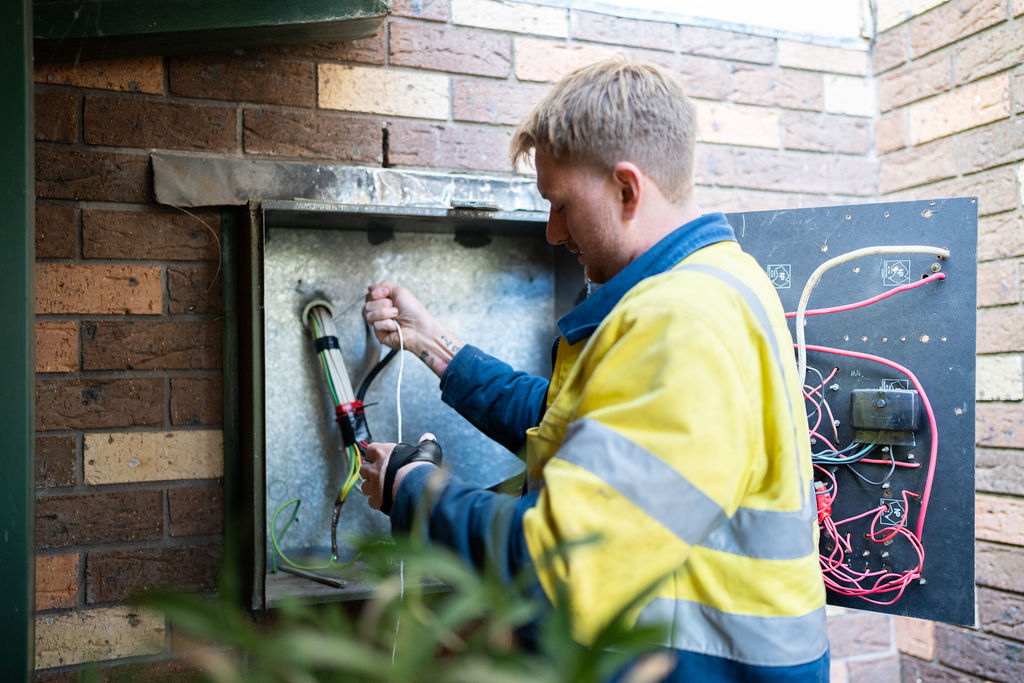 wollongong electrician checking a switchboard